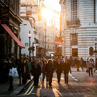 Crowd of people walking on street